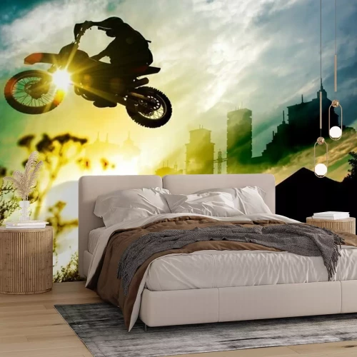 Papier peint  Évolution à moto sur fond de soleil couchant