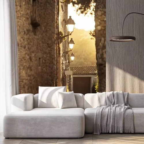 Papier peint  Ruelle pavée au lever du soleil