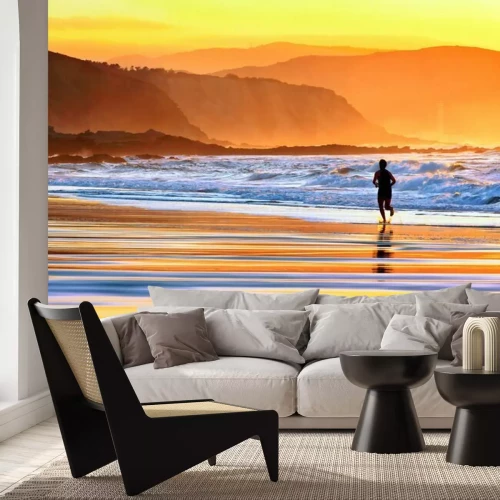 Papier peint  Coureur sur la plage au coucher du soleil