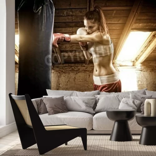 Papier peint  Boxeuse devant un sac de boxe