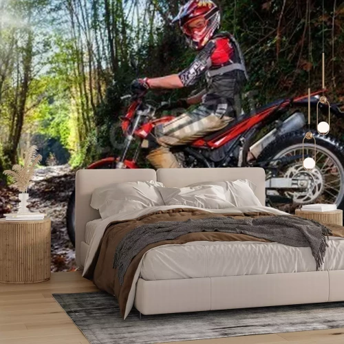 Papier peint  Full length portrait of motocross rider sitting on motorbike in woods.