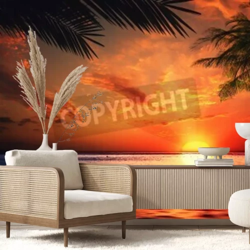 Papier peint  Le soleil couchant à moitié caché derrière l'horizon