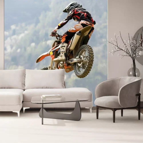 Papier peint  Un motard en vol sur fond de forêt