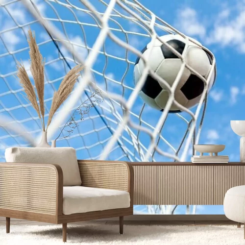 Papier peint  Football dans le filet sur le ciel