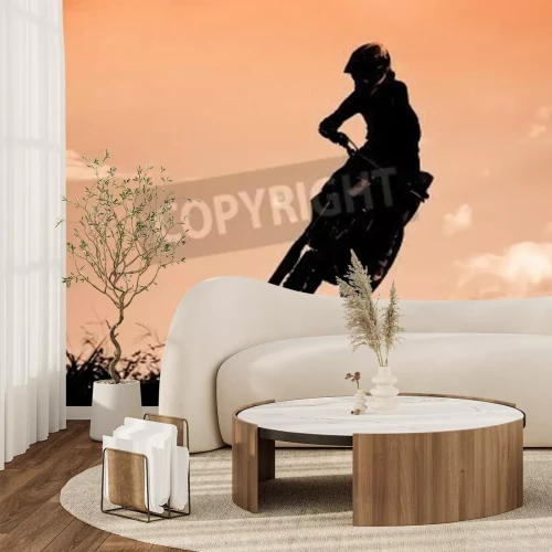 Papier peint  Statut des silhouate saut de motocross sur la lumière ambrée du coucher de soleil fond.