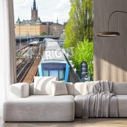 Papier peint  Train bleu au centre ville