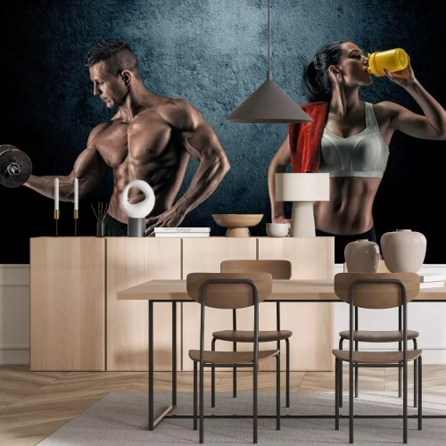 Papier peint  Couple faisant de l'exercice à la salle de sport