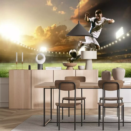 Papier peint  Un joueur de football en action dans un stade illuminé