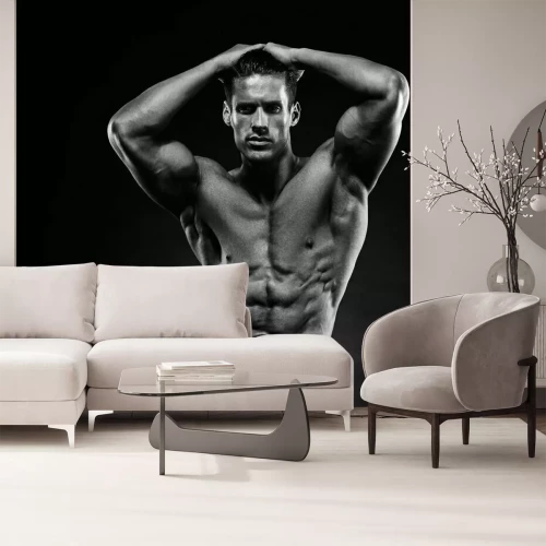 Papier peint  Un homme musclé sur fond noir