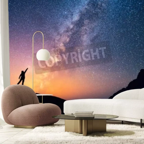 Papier peint  Une personne pointant les étoiles