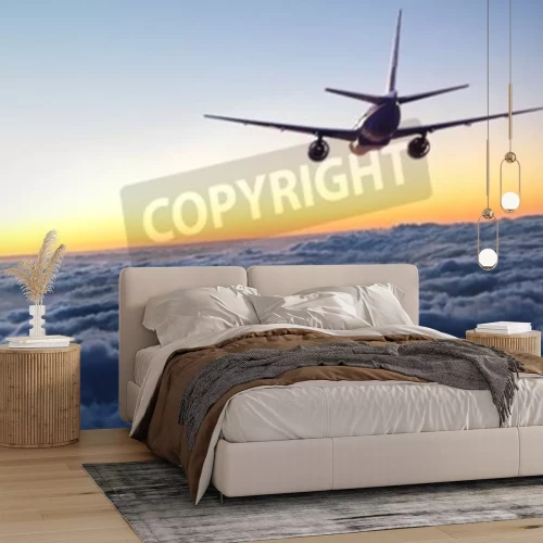 Papier peint  Avion volant vers le coucher du soleil