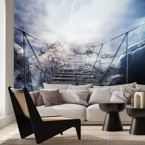 Papier peint  Un pont de corde au-dessus d'un gouffre dans la tempête