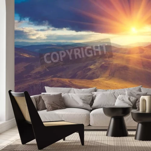 Papier peint  Lever de soleil sur un fond de nuages verts